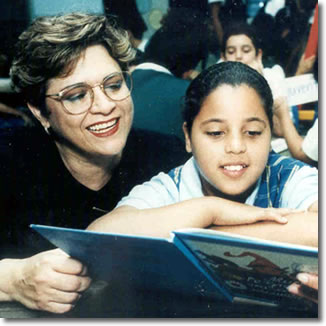 Dr. Robeldo Montecel and a student reading